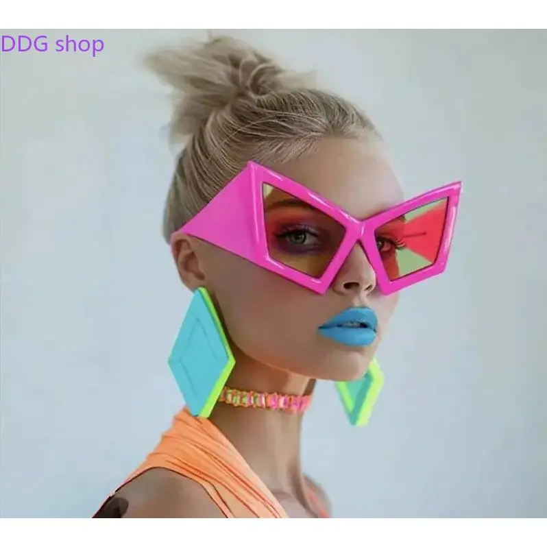 Statement Geometric Sunglasses, popular cat-eye style with sculptural frame and bold colorways. Durable construction and eye-catching look, great for beach trips, music festivals and making a fashion-forward statement.