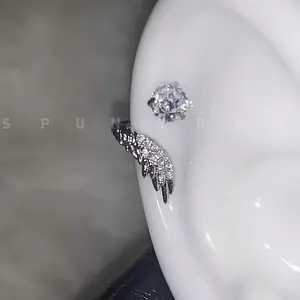 A pair of shiny angel wing earrings, suitable for cartilage piercings - wing-shaped stud and back design, secure and comfortable to wear, elegant and durable, suitable for daily wear, parties, and beach outfits - unisex, a stylish jewelry gift for all yea