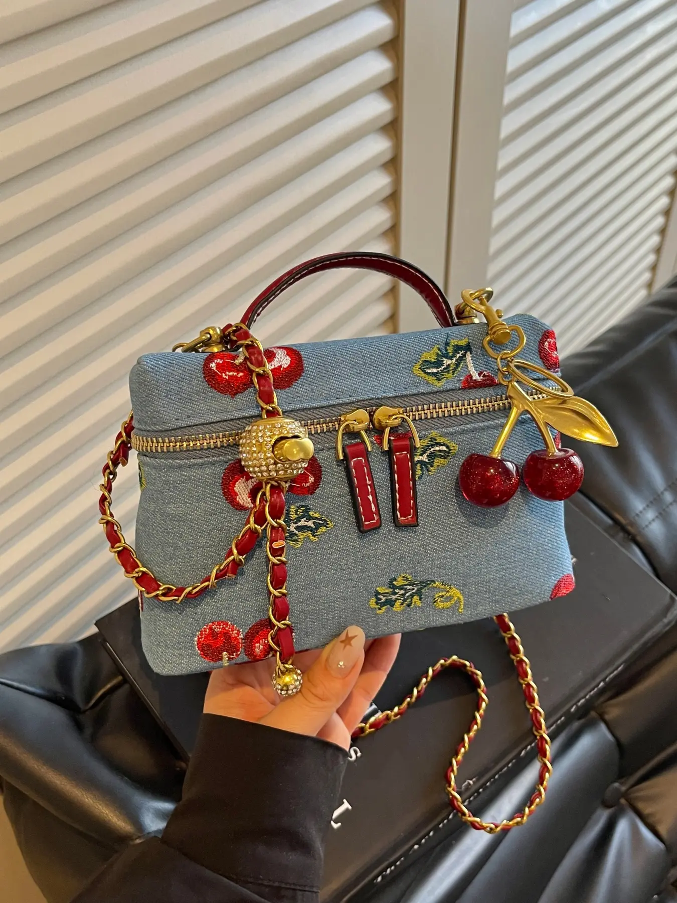Trendy textured cherry embroidered denim mini shoulder bag, featuring detachable and adjustable crossbody strap with cherry charm, fashionable and cute handbag for girls' dates, shopping or parties.