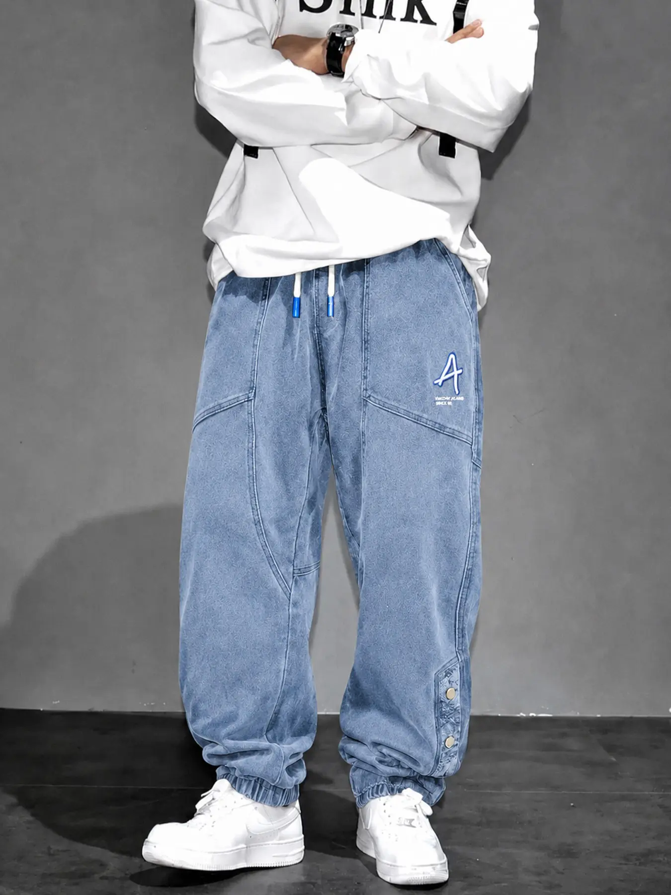 Men’s Black Washed Denim Jogger Pants with Drawstring Waist, Embroidered Letter and Snap Button Cuffs, Baggy Streetwear Jeans