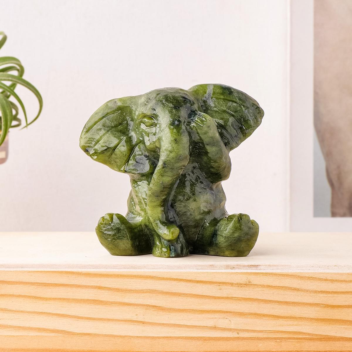 A Natural Jade Elephant Ornament—A Hand-Carved Masterpiece Infused with Spiritual Energy; A Serene Home Décor Accent and Healing Crystal Art Piece—A Distinctive Gift Rich in Symbolic Meaning. A Natural Jade Elephant Ornament—A Hand-Carved Masterpiece Infused with Spiritual Energy; A Serene Home Décor Accent and Healing Crystal Art Piece—A Distinctive Gift Rich in Symbolic Meaning.
