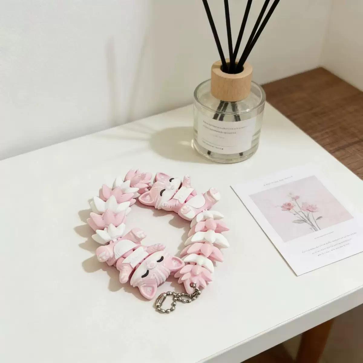 A 3D-printed keychain pendant featuring a cute little fox. The joints of the fox can move freely, making it a popular decorative item.