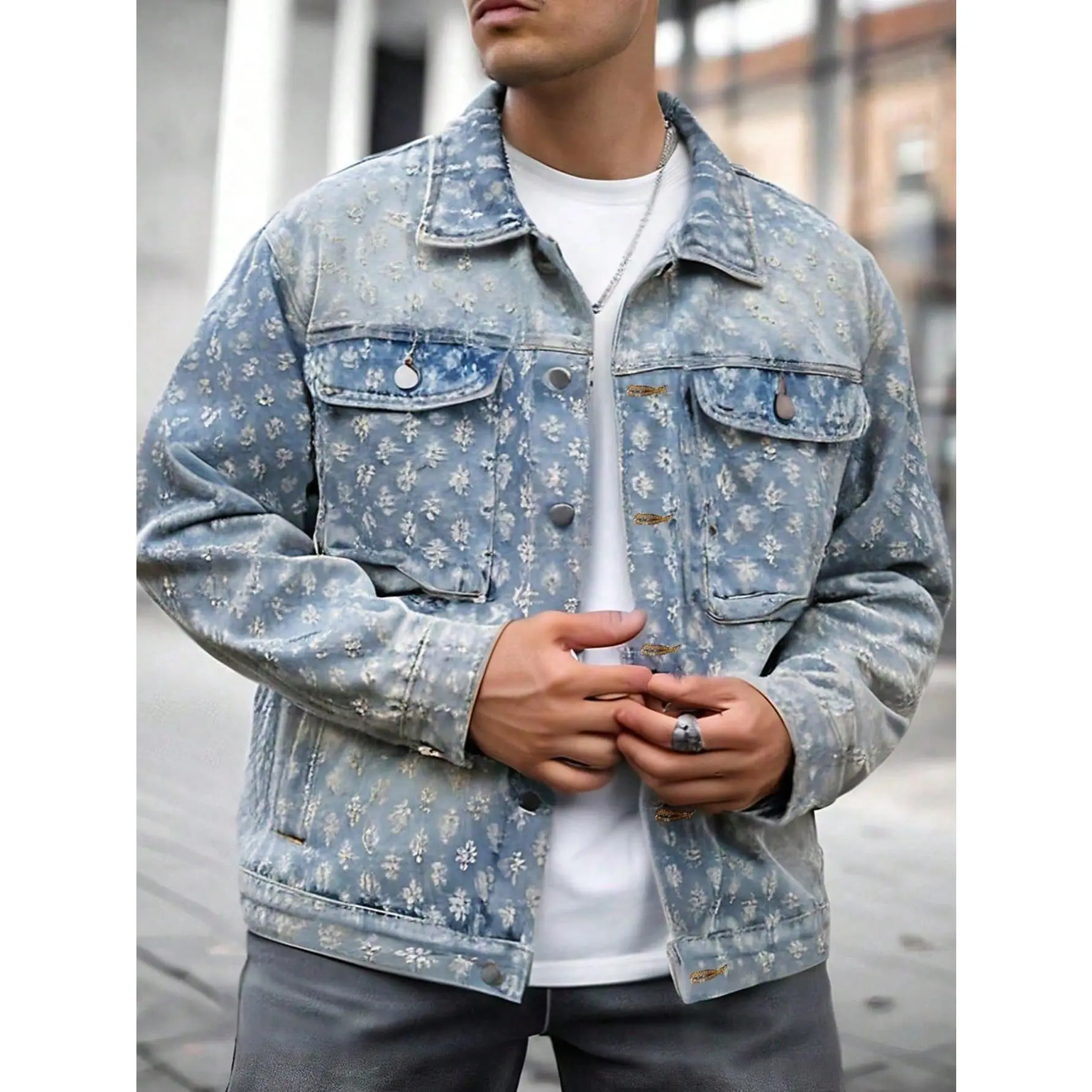 Textured floral embossed denim outerwear featuring a classic trucker structure, metal snap buttons, and stitched pocket detailing. This soft faded denim textile piece offers a regular relaxed fit and is a versatile foundational layering piece for street c