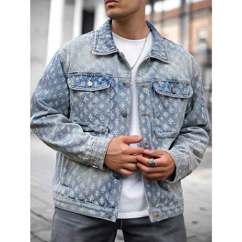 Textured floral embossed denim outerwear featuring a classic trucker structure, metal snap buttons, and stitched pocket detailing. This soft faded denim textile piece offers a regular relaxed fit and is a versatile foundational layering piece for street c