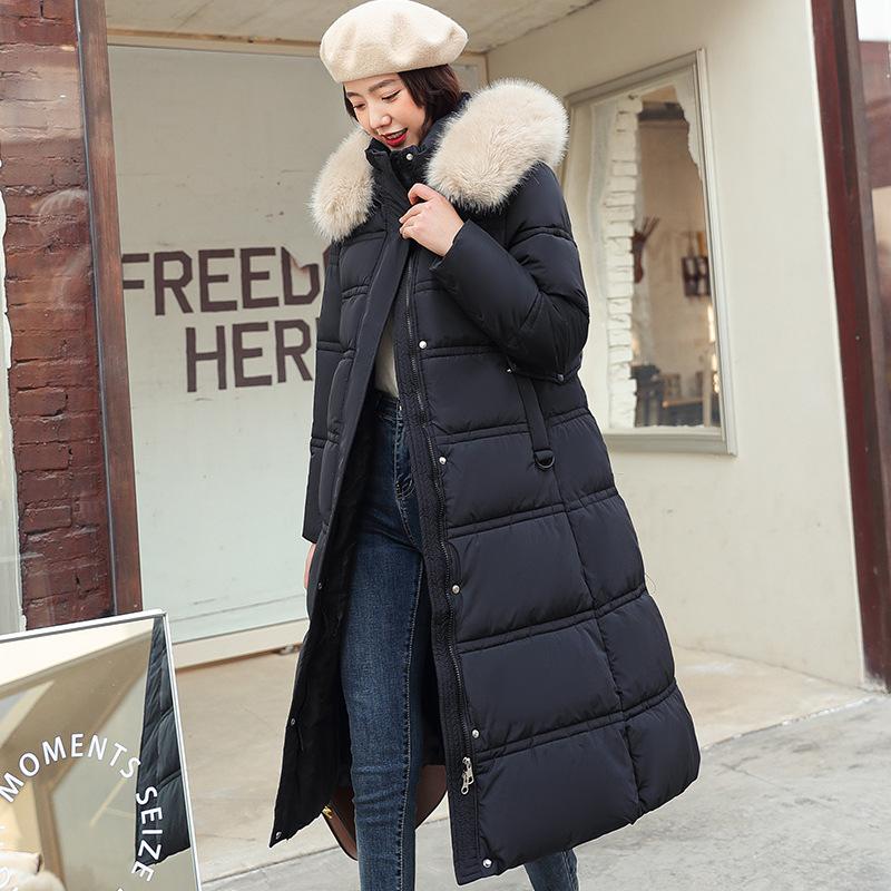 New winter women's thickened long over-the-knee hooded cotton-padded coat with large fur collar.