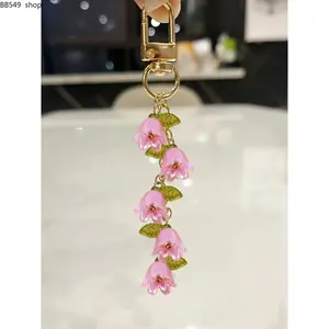 Women’s Lily of the Valley Flower Keychain – Floral Beaded Pendant with Tassel, Elegant Orchid Bag Charm Key Ring Accessory for Backpack, Car Keys & Christmas Gift Decoration