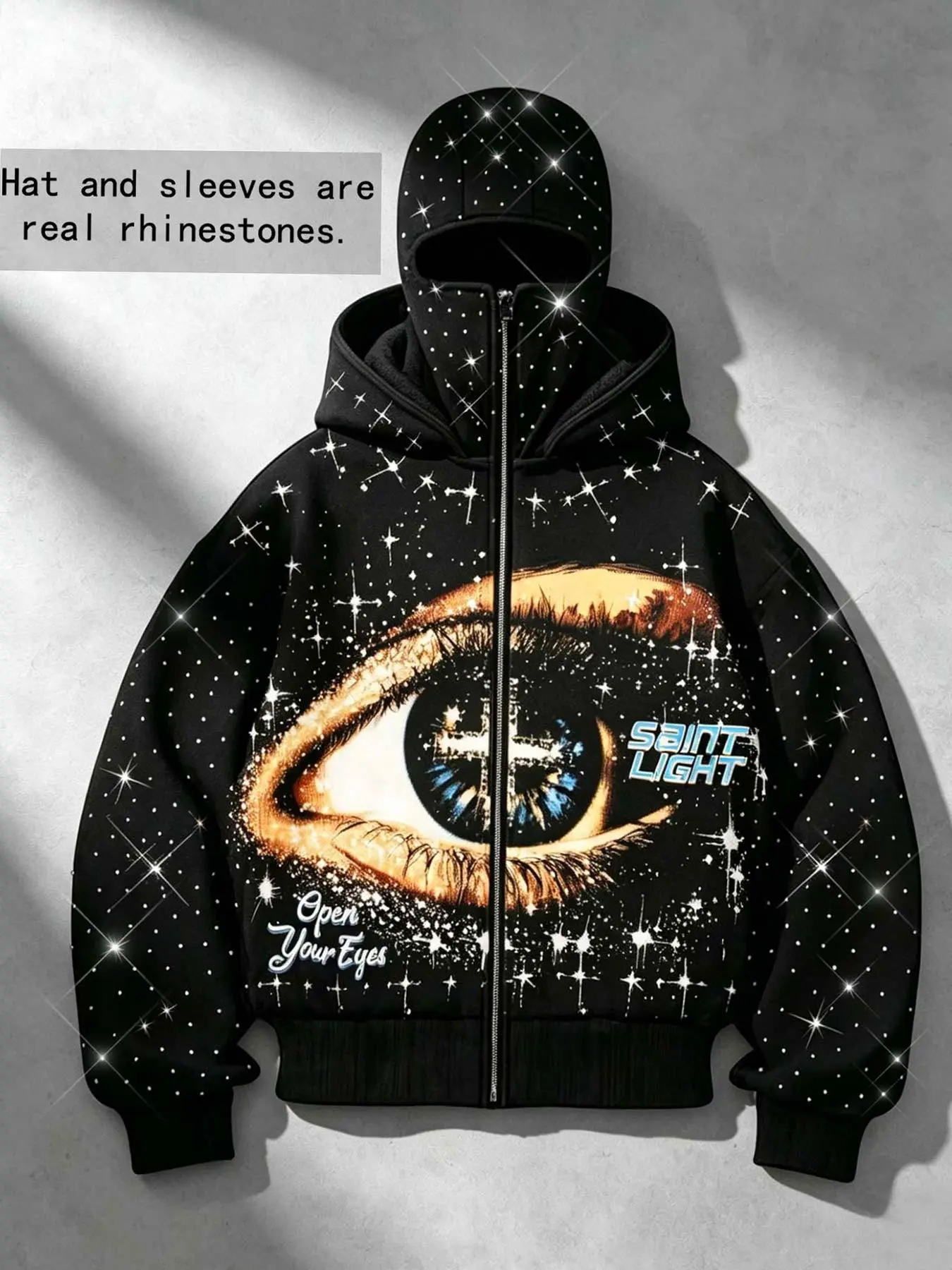 Men's fleece-lined hooded zip-up sweatshirt featuring "Starry Sky Sacred Eye" and cross motifs in hot-fix rhinestones; includes double-layer face-covering sleeves, all-over rhinestone detailing, and a dark Y2K high-street aesthetic.