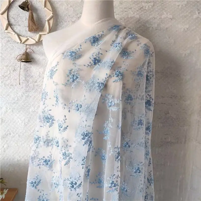 Blue floral embroidered tulle fabric by the yard, 3D flower mesh lace fabric for wedding dresses, bridal veils, and DIY sewing craft decorations