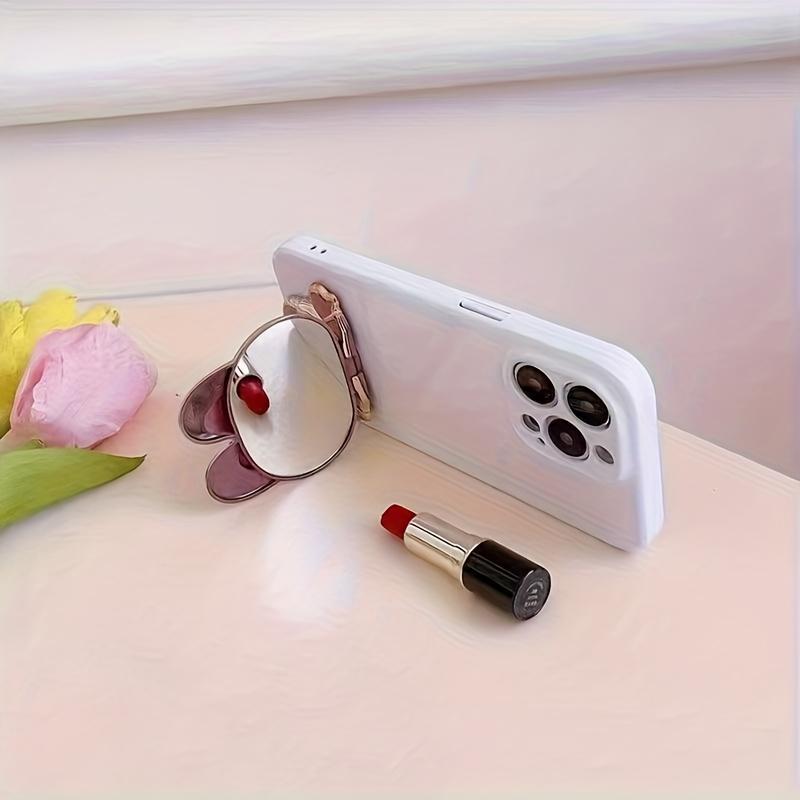 New rabbit-shaped adhesive phone stand with makeup mirror is suitable for iPhone, Samsung, Xiaomi phones, and various other phones. The rabbit phone case desktop stand is a hollow-out lazy stand
