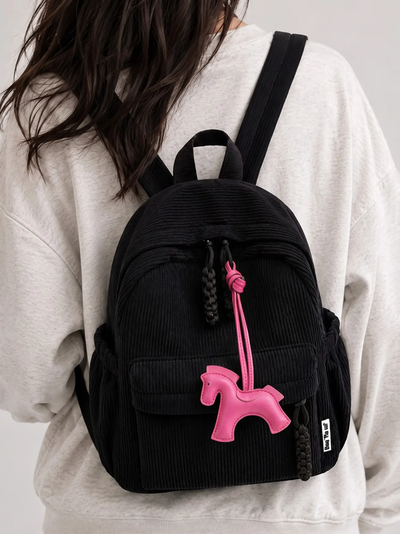 Women's black corduroy backpack with pony charm, cute and casual multi-pocket backpack, lightweight everyday travel backpack, suitable for teenagers, students and girls.