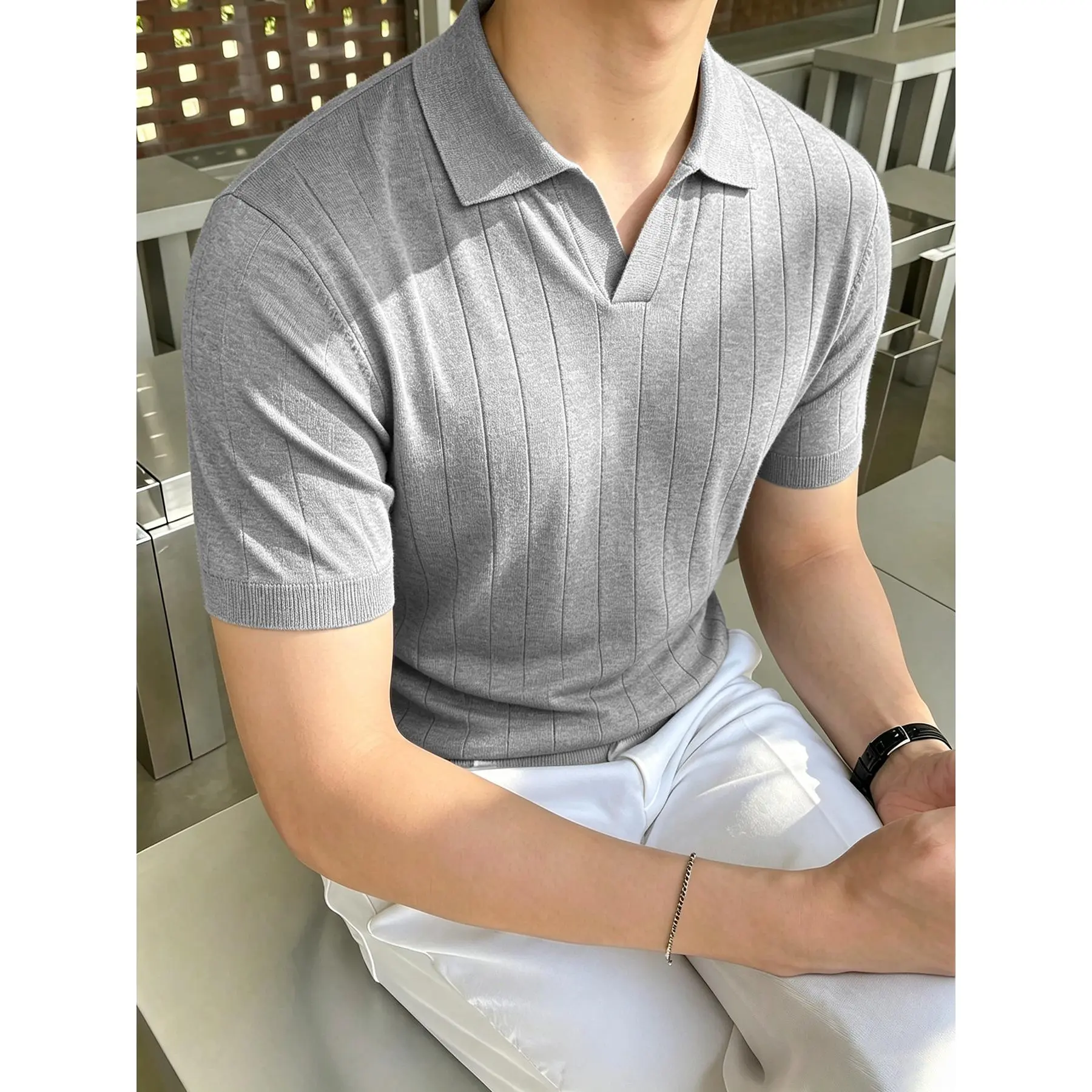 Vertical rib knit short sleeve polo shirt with open notch lapel collar, slim tailored stretch lightweight knit fabric finished ribbed cuffs sleek fitted silhouette smart basic top staple for refined casual modern mensfashion styling