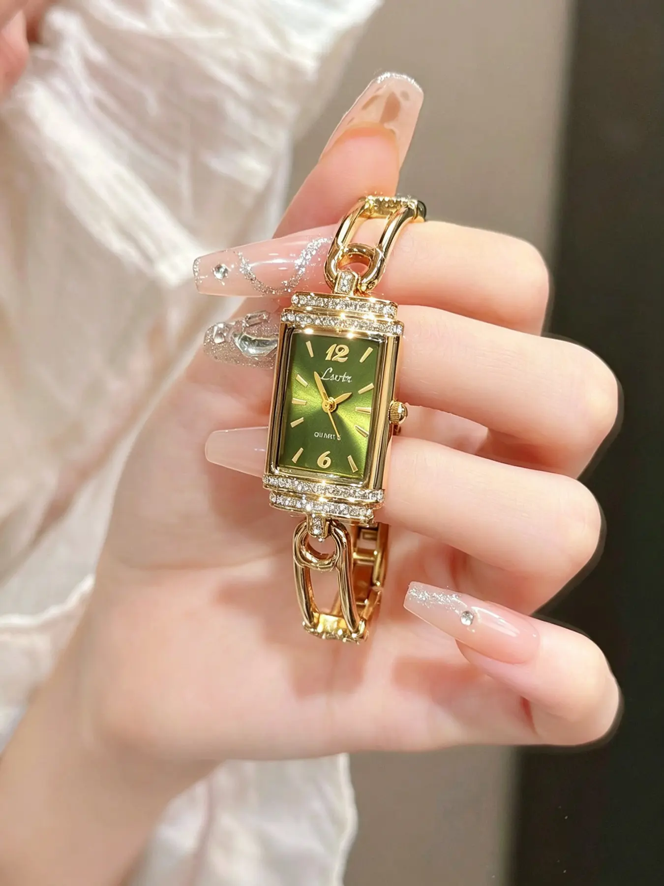 1 new gold advanced elegant exquisite ladies quartz watch paper clip bracelet mother-of-pearl dial rectangular case with simple niche design ladies waterproof watch.