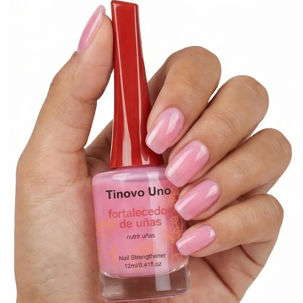 Tinovo Uno, Sheer nail polish, Nail products, features a peach-pink shade that creates a glass-like glossy finish, nourishing ingredients penetrate the nail surface to improve softness and layering, making your nails look beautiful strengthening