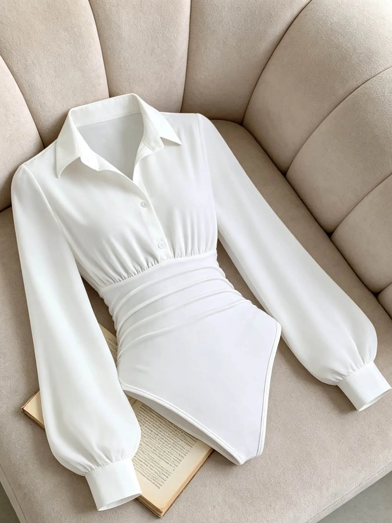 A fashionable women's collared bubble long sleeved jumpsuit with a waist cinching design and slim fit, suitable for indoor and outdoor commuting