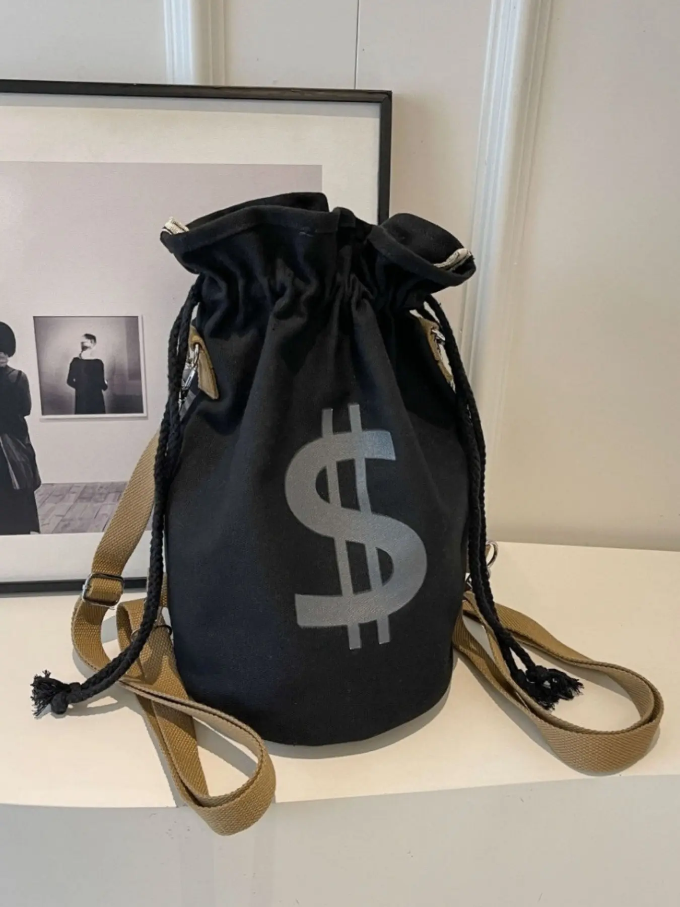 Unisex Money Bag Canvas Backpack, Graphic Backpack, Large Capacity Drawstring Bucket Bag with Bold Dollar Sign Print and Adjustable Strap, Convertible Backpack, Shoulder Bag and Crossbody Bag for Travel, Commuting, Shopping and Weekend Trips