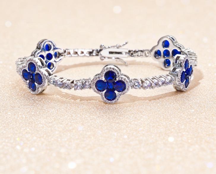 Paired with a 5A+ Sri Lankan Moissanite bracelet, featuring a four-leaf clover motif, colorful gemstone inlay, and a classic tennis chain design—crafted exclusively for women. This piece embodies a luxurious yet minimalist aesthetic, making it an ideal ch