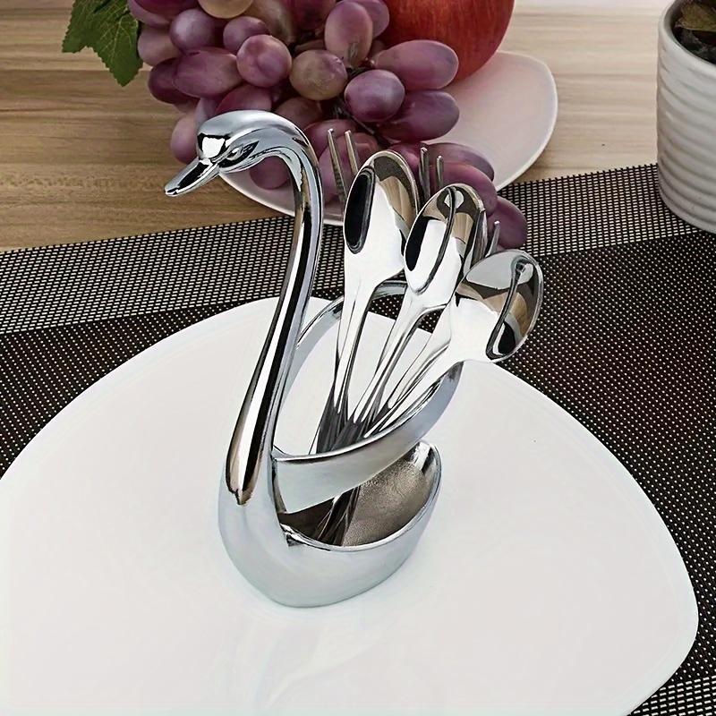 A 7pcs Stylish Cutlery Holder Designed Like a Swan, Including One Swan And Three Forks And Spoons Made of Zinc Alloy. This Elegant Stainless Steel Cutlery Rack Comes with a Complimentary Set of Forks And Spoons