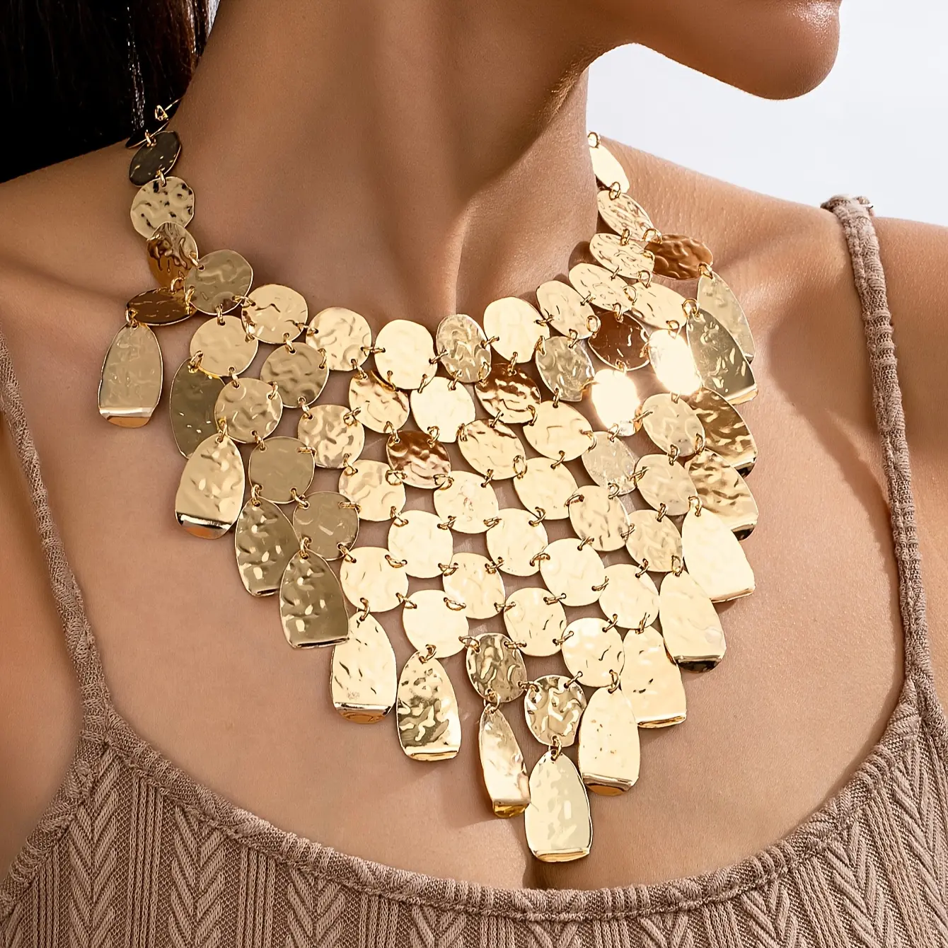 A fashionable and exaggerated metal disc tassel bib necklace for women's party and disco fashion outfits