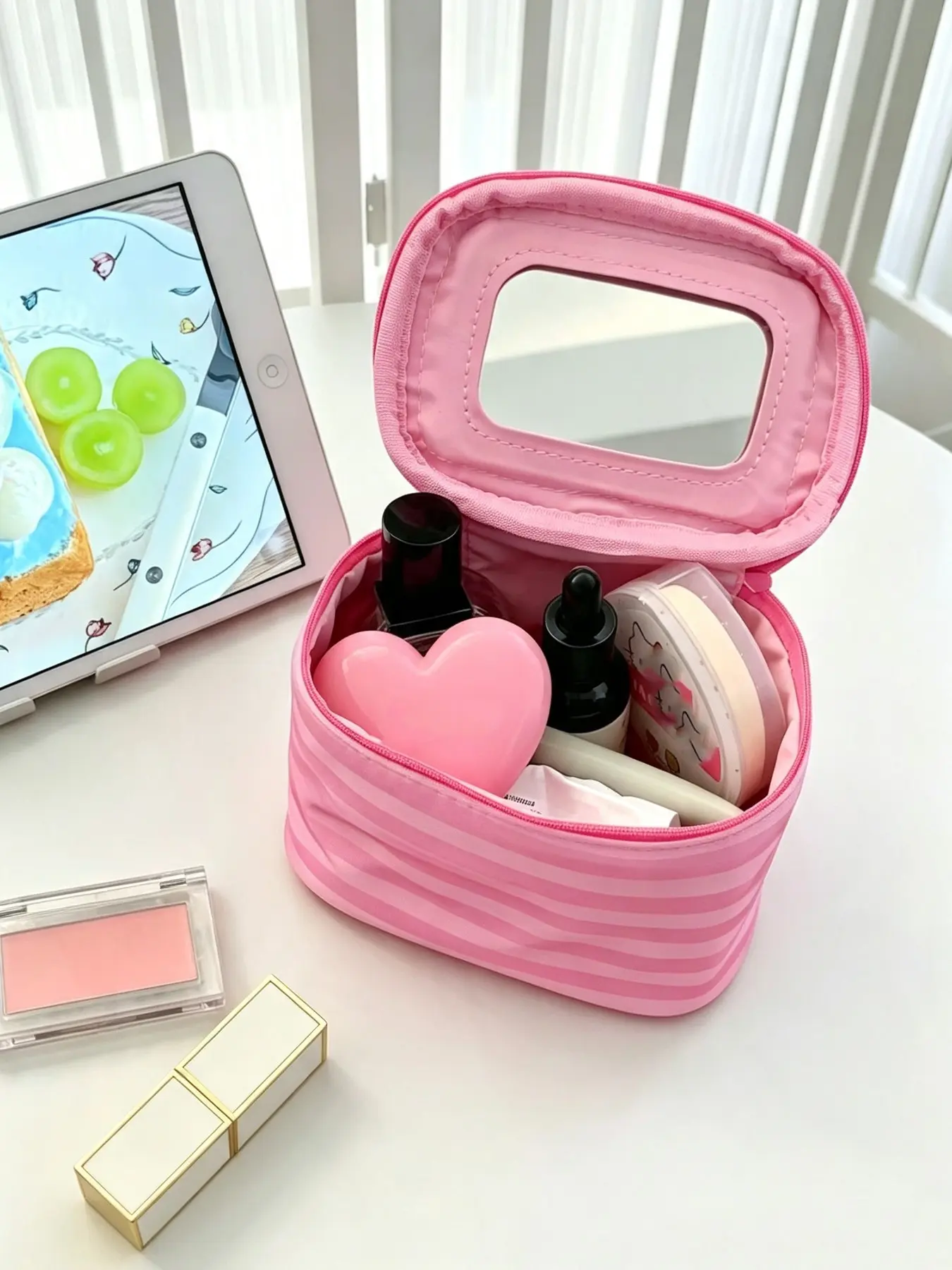 Pink‑striped makeup bag with built‑in mirror, zipper‑style travel cosmetic storage bag, portable organizer for beauty supplies and toiletries