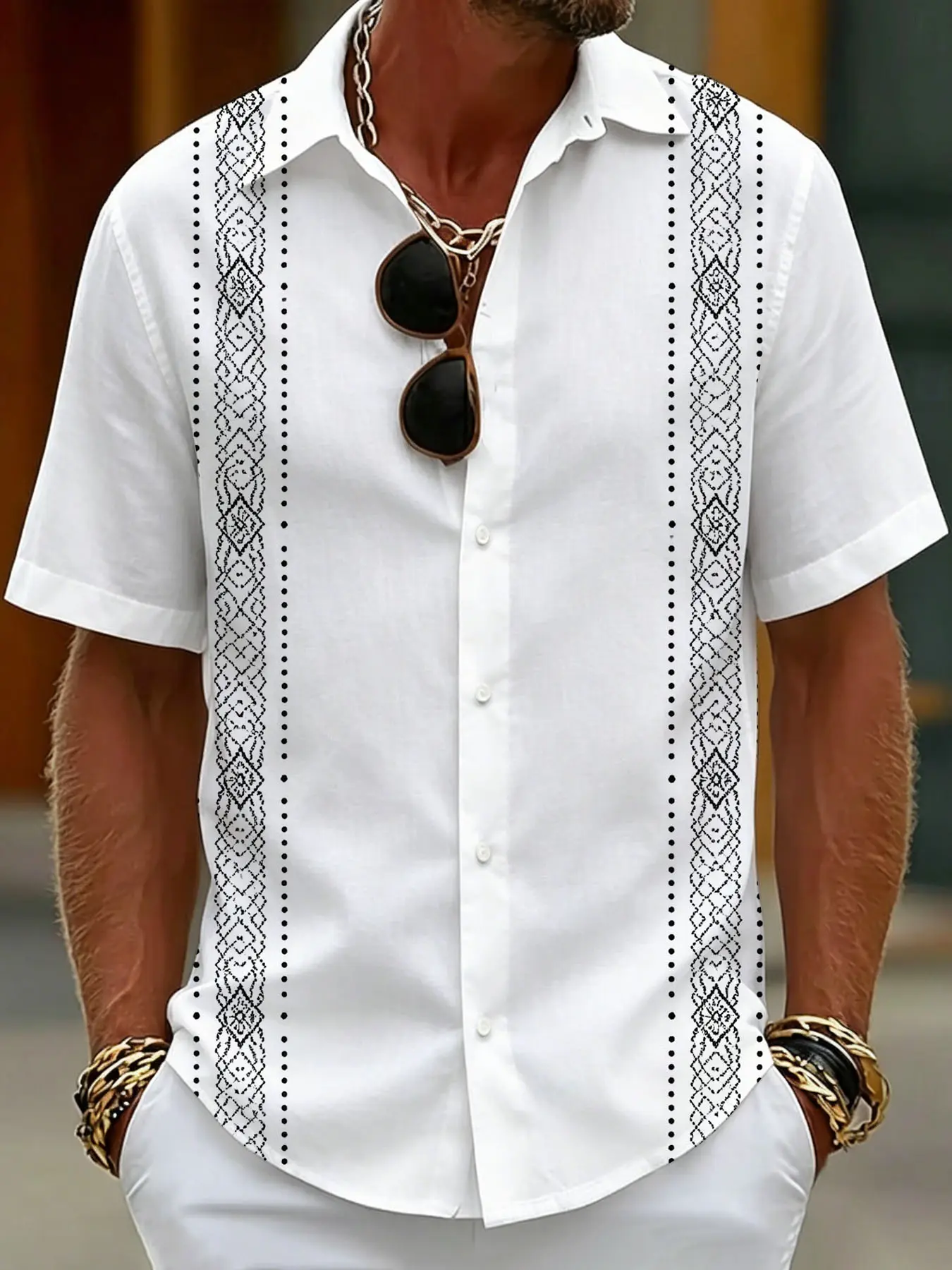 Short-sleeved shirt with ethnic-style line prints on the side against a white background, a casual men's top