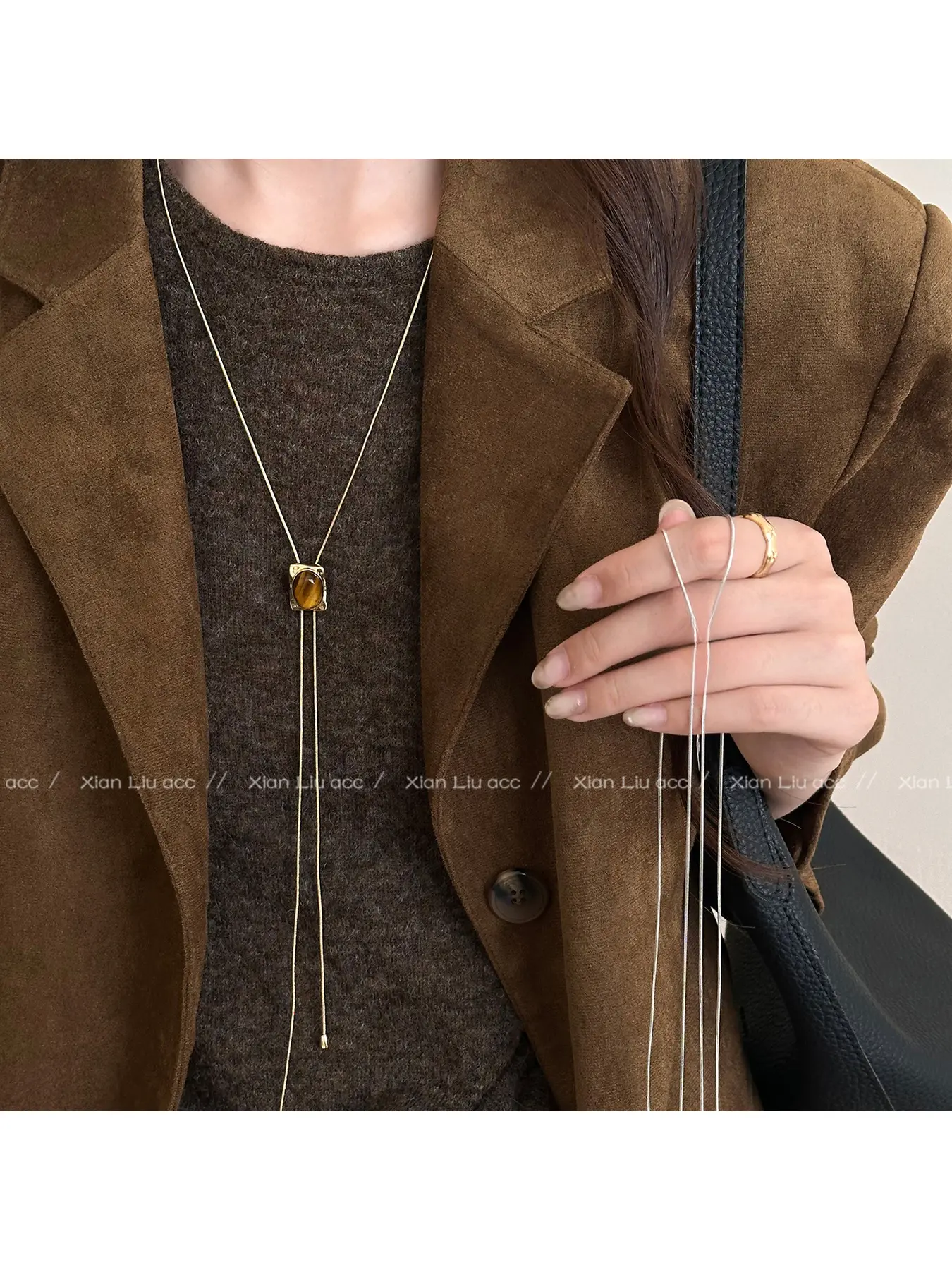 Popular on Douyin! Adjustable and retractable women's tiger - eye stone necklace. The 2026 new style long - length sweater chain for autumn and winter is a luxurious and high - end accessory.