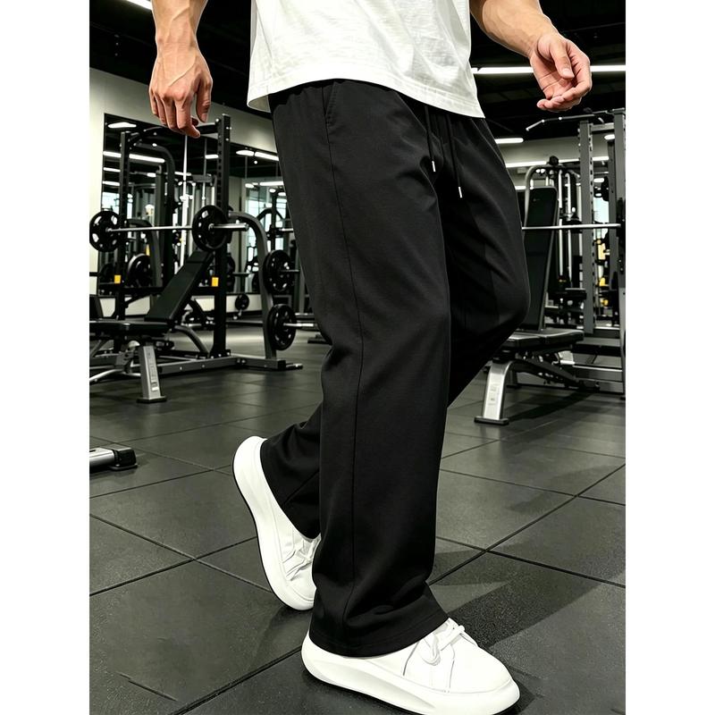 Soft pure cotton wide leg athletic trousers with adjustable drawstring waist, breathable lightweight fabric loose full-length silhouette deep side pockets versatile gym casual essential for modern street mensfashion daily wear