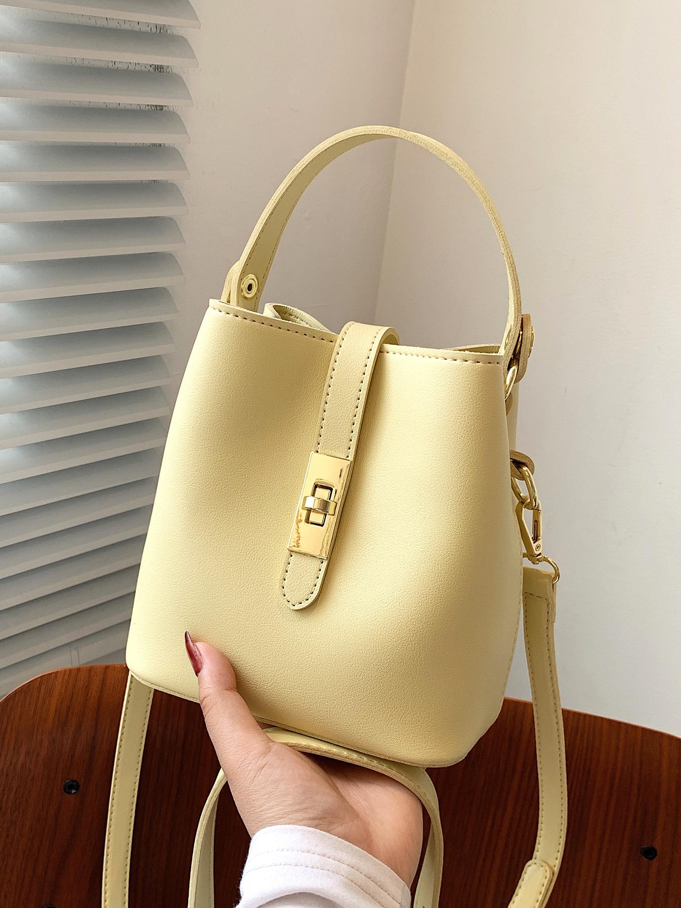 Niche design bucket crossbody bag, simple textured metal buckle decorated single shoulder crossbody handbag, fashionable and versatile daily commuting essential item, large capacity suitable for office workers, shopping, etc.