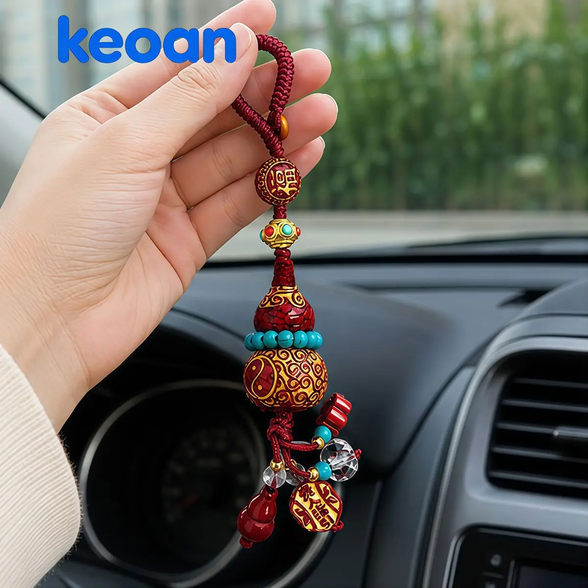 A car keychain or bag charm, featuring a traditional Chinese red gourd pendant with a burgundy handmade braided cord,Keychain bag charm, symbolizing warding off evil, bringing good fortune, and ensuring safety and smoothness.