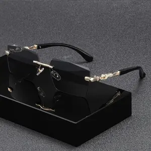 A pair of frameless rectangular sunglasses with gold accents, UV400 protection, luxurious unisex design, suitable for the beach and travel, a stylish and compact summer accessory.