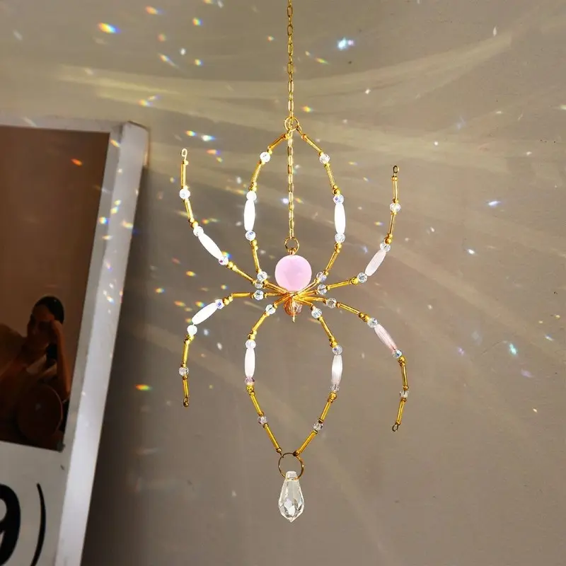 Handmade beaded spider sun catcher with pink crystal spider. Hang on windows or in gardens. Great for indoor/outdoor decor: backyard, ceiling, rooms