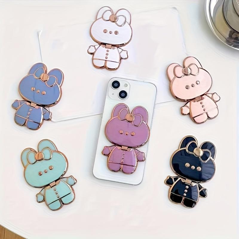 New rabbit-shaped adhesive phone stand with makeup mirror is suitable for iPhone, Samsung, Xiaomi phones, and various other phones. The rabbit phone case desktop stand is a hollow-out lazy stand