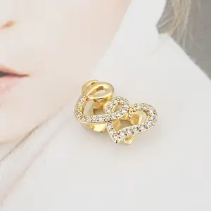 Double Heart Copper Teeth Grills with Inlaid Zircon, trendy hip-hop style dental decor. Stylish personalized tooth accessory for parties, performances and daily street looks.