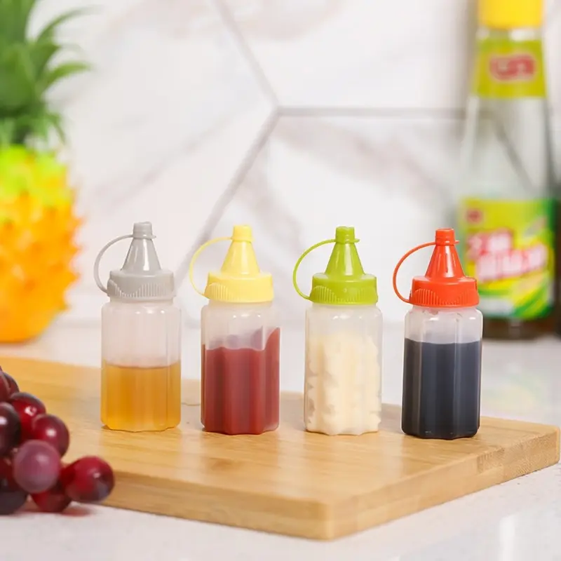 4PCS Mini Sauce Bottles Set - Leak-Proof Portable Condiment Squeeze Bottles Seasoning Containers for Office Lunch, Picnics, and Kitchen, Perfect for Storing Oil, Soy Sauce, Honey, Salad Dressings, and Spices - Durable and Affordable Kitchen Utensils