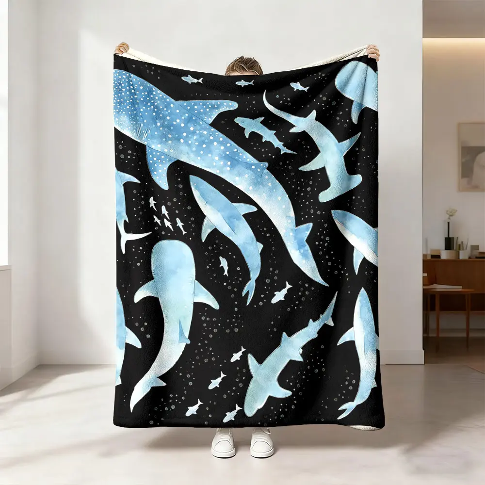 This blue and white shark-patterned flannel blanket is soft, warm, and versatile, suitable for use as a sofa bed cover, an office nap blanket, an outdoor camping blanket, or a gift for all seasons.
