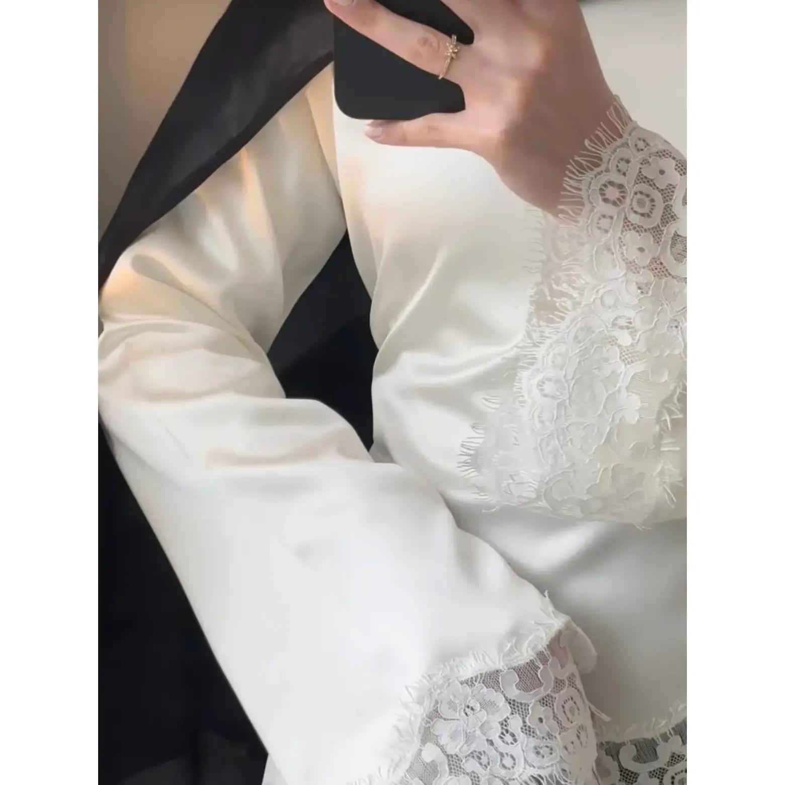 Lace trimmed satin lace up shirt