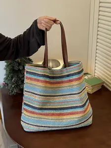 must be translated as "appearance value"    Original: Lazy bohemian style openwork straw tote bag with breathable straw material for a dry and non-stuffy feel, eye-catching striped design with multicolor block prints, open-top large capacity for effortles
