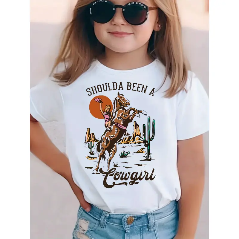 Girls' Athletic Knit Graphic Short Sleeve T-Shirt - 3-4 Years,5-14Y,11-12Y, All Seasons, Animal Character Design: Orange Sun, Brown Rearing Horse With Pink Rider, Bold Brown 'SHOULDA BEEN A' Text, Cursive 'Cowgirl' Below, For Young Dreamers