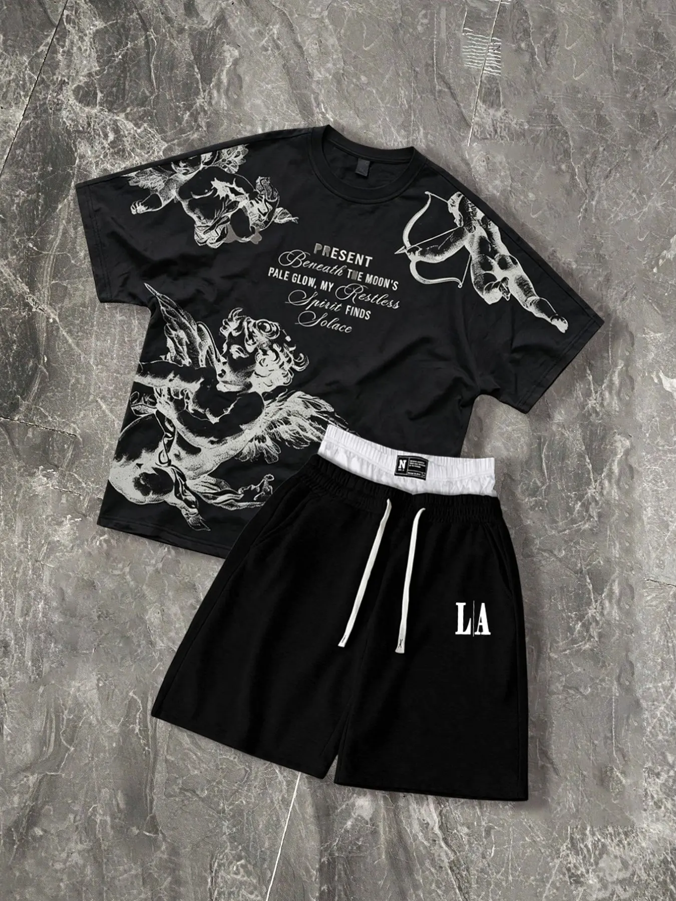 The men's two-piece set features a Renaissance-era angel print and includes a short-sleeved T-shirt and a pair of double-waisted casual shorts.