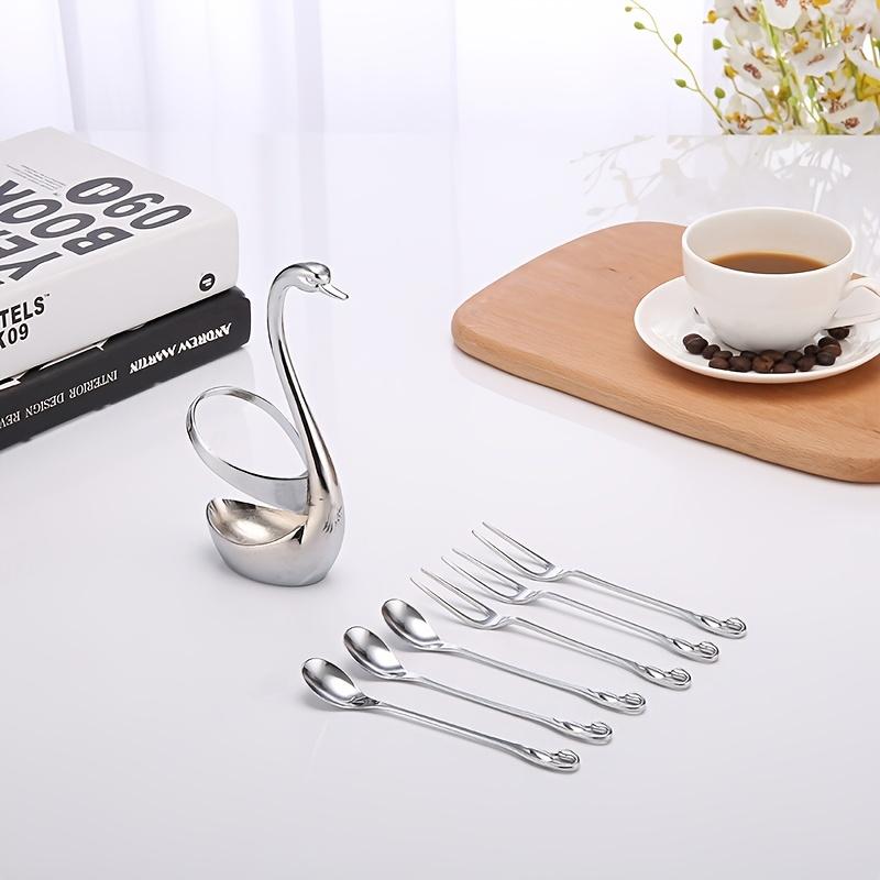 A 7pcs Stylish Cutlery Holder Designed Like a Swan, Including One Swan And Three Forks And Spoons Made of Zinc Alloy. This Elegant Stainless Steel Cutlery Rack Comes with a Complimentary Set of Forks And Spoons