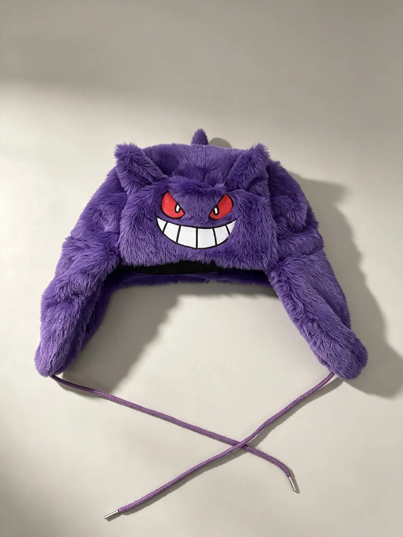 Plush purple fuzzy winter trap hat with adjustable earlobes and drawstring cartoon street warm hat