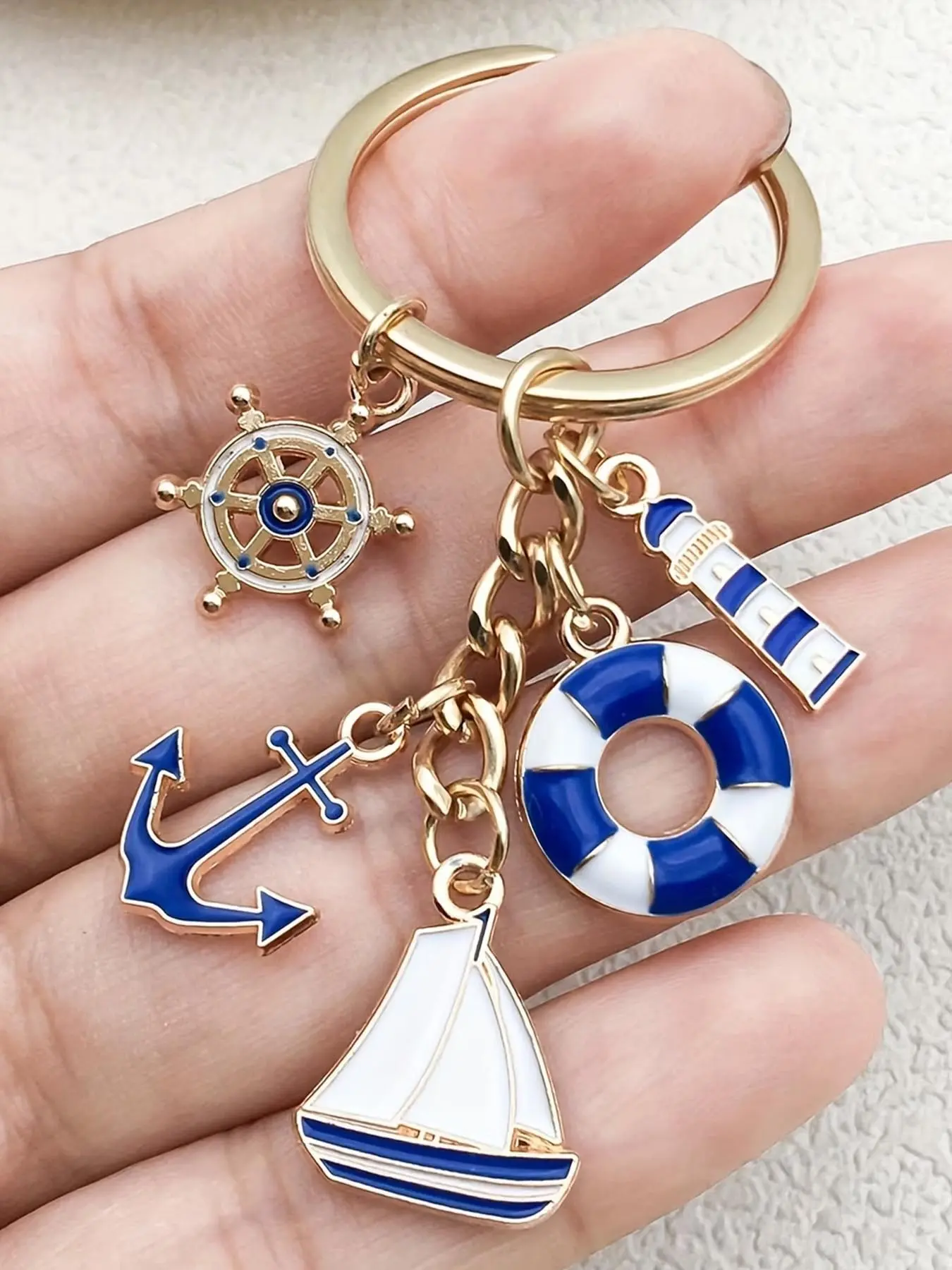 1pc Blue Sailing Enthusiast Keychain, Nautical Theme Keychain, Sailboat Anchor Rudder Life‑buoy Lighthouse Metal Key Pendant Gift for Men, Keychain Charm