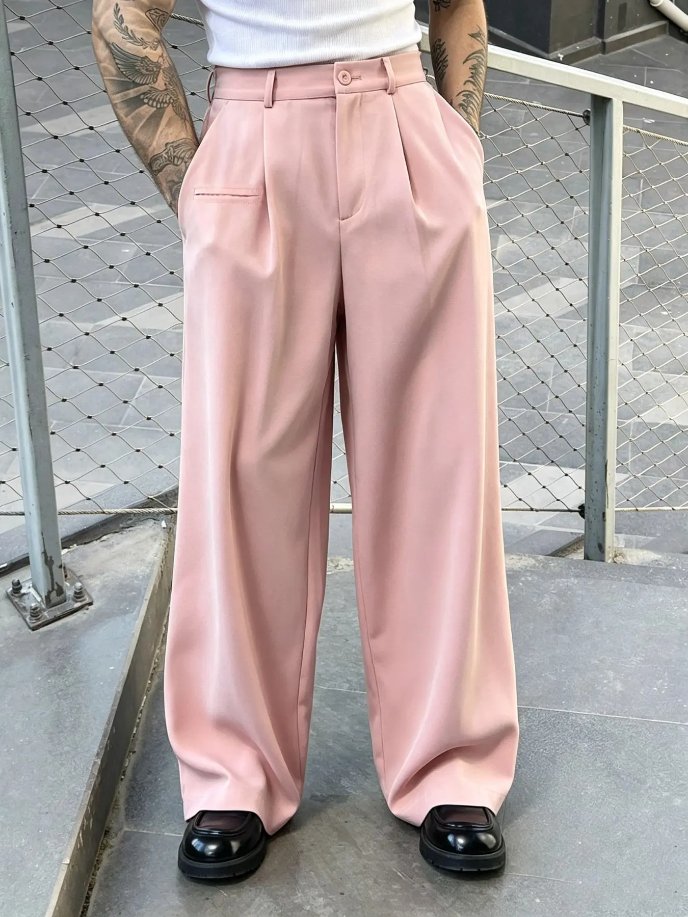 Men's solid-color, Loose trousers featuring a straight-leg cut and a fluid drape. Crafted from a lightweight, breathable, and soft woven fabric, these versatile pants are suitable for both business and casual settings, while distinctive design details