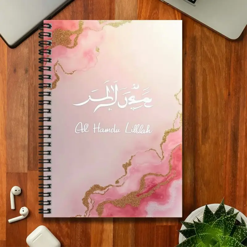 An Islamic-style pink marble-pattern spiral notebook, featuring Arabic script and the words "Al Hamdu Lillah" on the cover, is exquisitely beautiful. Suitable for work records, study notes, daily plans, etc., it is also a thoughtful gift for graduation or