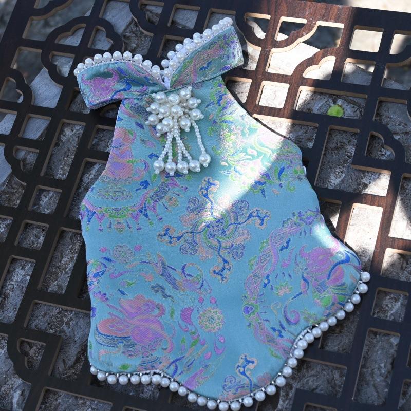 Paws Trendy Pet Spring & Summer Qipao for Dogs & Cats, suitable for Teddy, Bichon Frise and other small dogs. Features embossed fabric with exquisite retro frog buttons, fine workmanship, exuding noble elegance and making your beloved pet stand out.