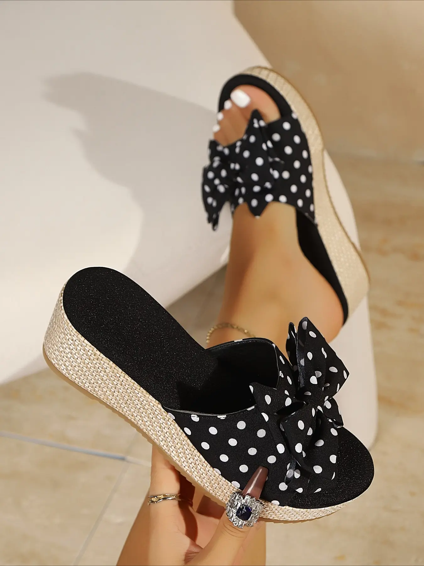 Polka dot slide sandals decorated with big bow, woven wedge sole, open toe slip-on shoes, cute casual summer footwear for daily wear.