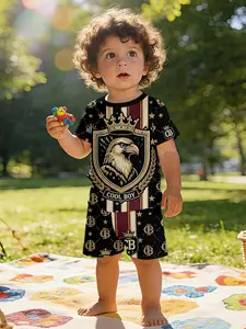 Light luxury handsome baby short-sleeve set with digital printing of shield emblem featuring crown and eagle with gold trim on black background, casual kids' wear for infants, T-shirts suitable for daily wear and outdoor activities, 100% polyester, an ide