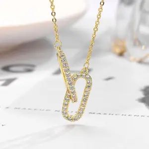 Double oval necklace with interlocking rings and diamond-studded pendant, a light luxury high-end accessory