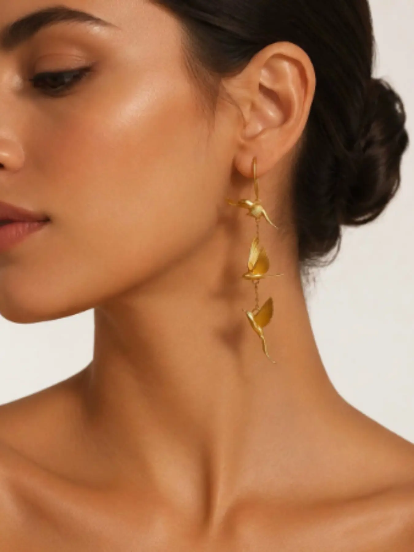A pair of Vintage Gold Color Bird Pendant Earrings with Flapping Wings Suitable for Ladies' Banquets Parties Jewelry Accessories Gifts