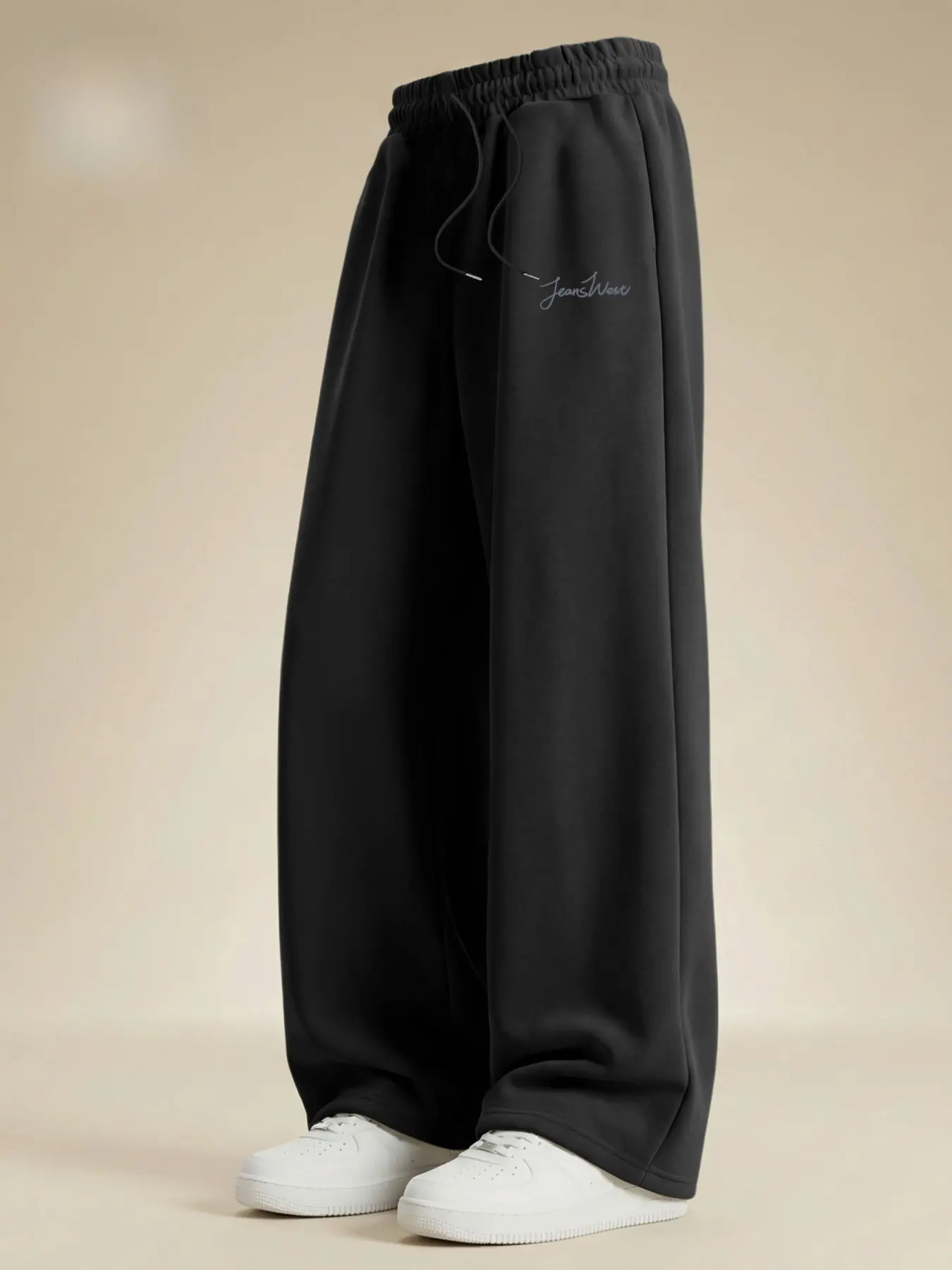 Trendy Minimalist Solid Black Loose-Fit Jogger Sweatpants for Men, featuring exquisite understated handwritten print details. Equipped with pleated elastic waistband, crafted from breathable fabric suitable for all seasons that resists shrinkage after was