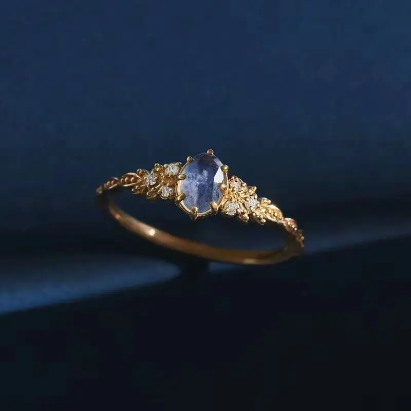 Japanese-style openwork ring for women featuring natural iolite and labradorite, accented with "Olive Leaf" motifs and purple cubic zirconia.